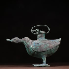 A bronze duck-shaped statue