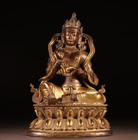 A Qing Dynasty bronze gilt clam Guanyin statue