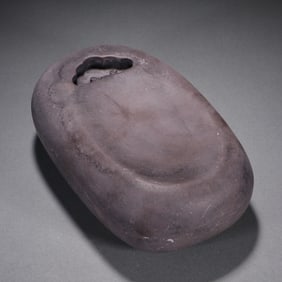 A piece of Qing Dynasty oval stone carved inkstone