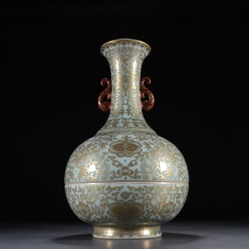 A piece of Qing Dynasty bean green glaze painted gold entwined branch lotus appreciation bottle