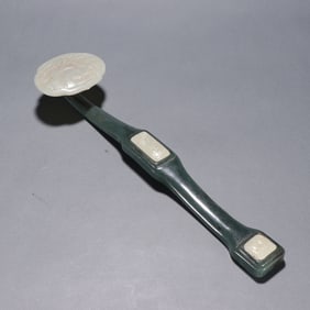 A piece of clear jasper inlaid with Hetian white jade Ruyi a handle