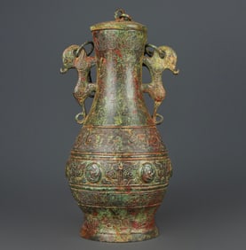 A piece of Western Zhou bronze double dragon chain bottle