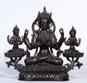 A Qing Dynasty four-armed Guanyin bronze statue