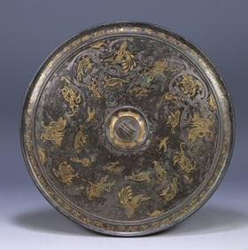 A Han Dynasty wrong gold and silver beast pattern bronze mirror (repaired) size
