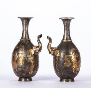 A pair of gilt silver water purification bottles