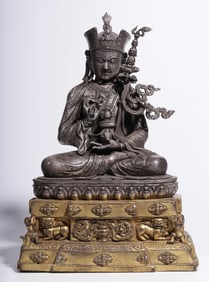 A Qing Dynasty silver-gilt statue of Padmasambhava