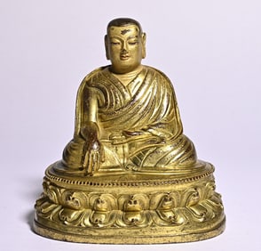 A bronze gilt Tibetan Buddha statue study ornament