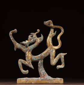 A Han Dynasty bronze gilt dragon ornament