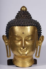 A Qing Dynasty bronze gilt Shakyamuni Buddha head