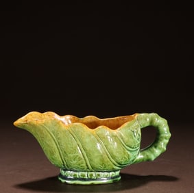 A piece of Tang Dynasty green glazed bamboo leaf cup