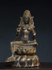 A bronze statue of Green Tara