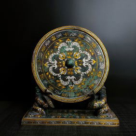 A Warring States bronze - a silver bronze mirror