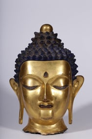 A piece of Qing Dynasty bronze gilt Shakyamuni Buddha head