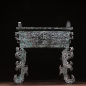 A bronze four-legged square tripod