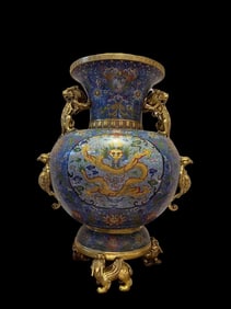 A piece of copper gilt cloisonné filigree enamel dragon and phoenix bottle