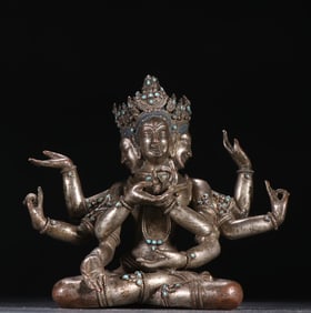 A Qing Dynasty silver fetus three-headed and six-armed Guanyin statue