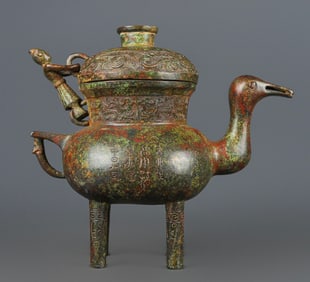A Han Dynasty bronze four-legged duck pot