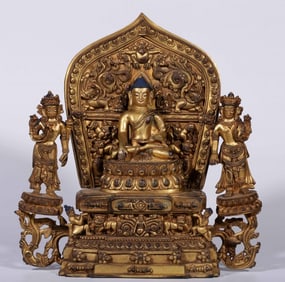A Qing Dynasty bronze gilt seated statue of the Three Saints of the West