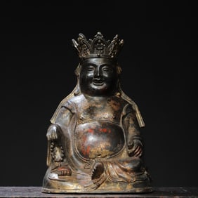 A bronze gold Maitreya Buddha statue