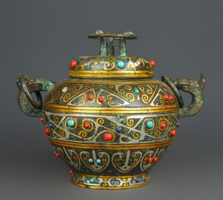 A piece of Han Dynasty bronze and gold and silver inlaid with many precious stones