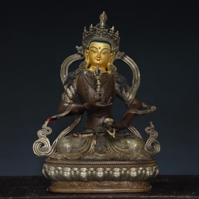 A bronze and silver painted Buddha statue of Sata Vajra