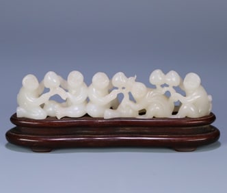 A late Qing Hetian jade "five monkeys offer longevity" ornament