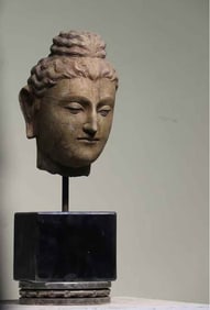 A statue of Gandhara art Buddha preaching