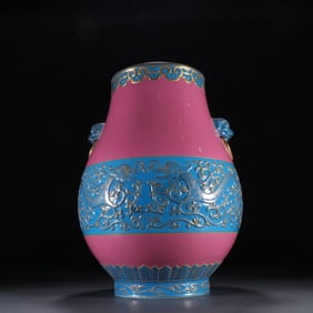 A piece of clear carmine glaze engraved dragon pattern lion face