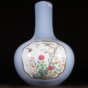 A piece of clear sky blue glazed windowed pastel flower and bird pattern celestial globe bottle