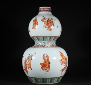 A Qing Dynasty Kangxi alum red group of immortal gourd bottles