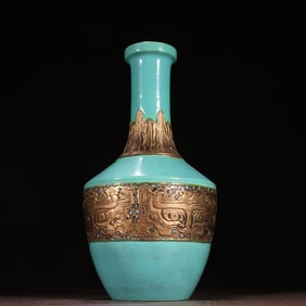 A piece of turquoise green glaze bronze color animal pattern appreciation bottle
