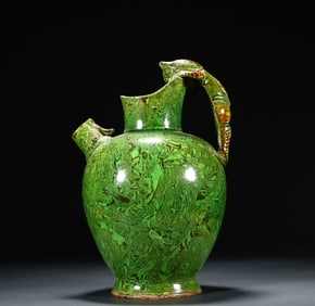 A piece of Tanggong County kiln twisted tire green glaze beast handle pot