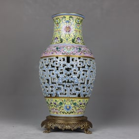 A vase carved in pastel on yellow ground with a copper background