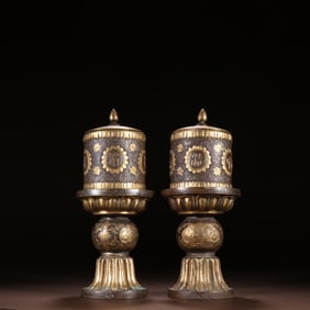 A pair of copper-gilt offerings