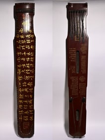 A piece of lacquerware depicted with gold, poems, and seven mystical guqins