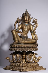 A Qing Dynasty "Great Qing Dynasty Kangxi" bronze gilt inlaid turquoise Guanyin sitting statue