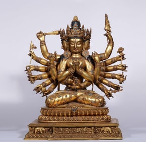 A Qing Dynasty bronze gilt inlaid Baibao Zhun Timu statue