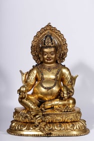 A Qing Dynasty bronze gilt statue of the God of Wealth