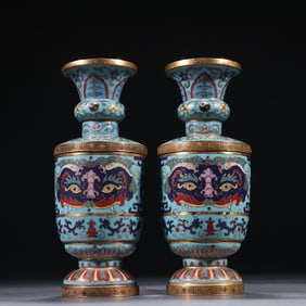 A pair of gilt cloisonné animal face pattern vases