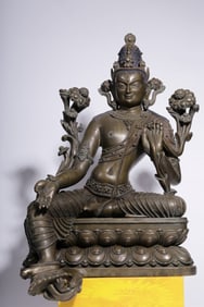 A Qing Dynasty two-color alloy bronze mistake silver green Tara statue