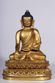 A Qing Dynasty bronze gilt statue of the Buddha who does not move
