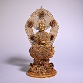A silver gilt filigree Guanyin scholar's ornament