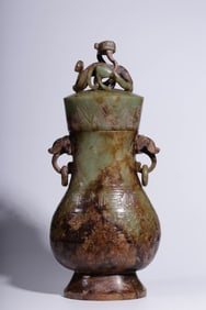A piece of Zhan Han Hetian jade carved gluttonous pattern double beast ear cap bottle