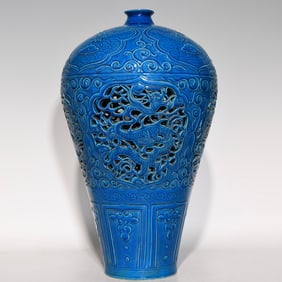A bright blue glazed hollow dragon and phoenix pattern plum vase