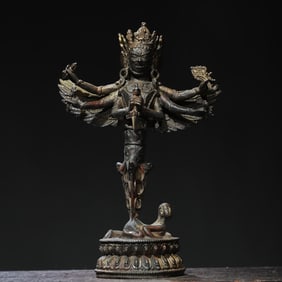 A bronze gold rubbing six-armed Vajra Buddha statue