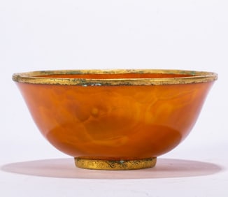 A piece of agate wrapped in gold bowl
