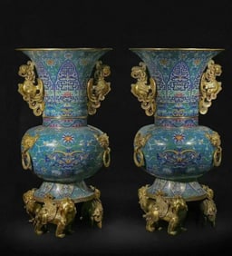 A pair of cloisonné enamel three beasts with ringed phoenix ear bottles