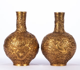 A pair of bronze gilt dragon and phoenix celestial ball bottles
