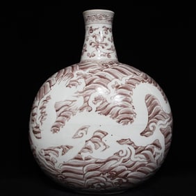 A white flat bottle with red dragon pattern in the glaze