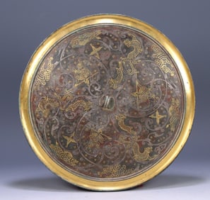 A Han Dynasty bronze mirror with gold and silver animal patterns (restored)